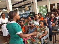 File photo: A nurse speaking to patients at the Korle-Bu Teaching Hospital