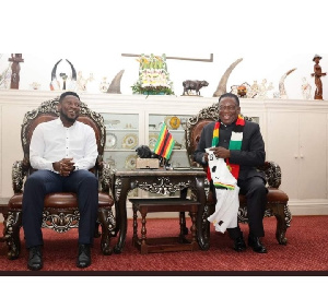 Asamoah Gyan (Left) with Zimbabwean President, Emmerson Mnangagwa