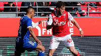 Alexander Djiku (left) tackles an opponent during a match