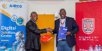 Mr. Ambrose Yennah and Professor Fred McBagonluri in a handshake