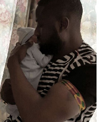 Elikem Kumordzi with his daughter