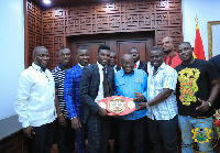 Commey presenting the title to President Akufo-Addo