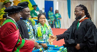 Samini receiving his certificate at the graduation