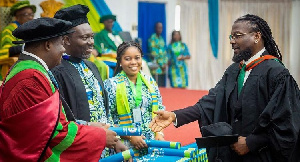 Samini receiving his certificate at the graduation