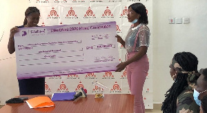 Mz Jhay receiving the prize