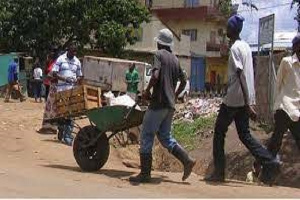 A man pushing a wheelbarrow