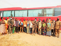 The deportees under escort by armed GIS personnel