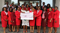 Mabel Adjoa Koomson flanked by some staff of Zenith Bank