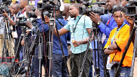 A photograph of photo journalists at work