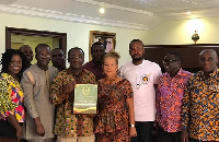 Dr. Owusu Afriyie Akoto displaying his award