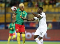 Ghana's Yiadom challenge Cameroon's Njie for the ball