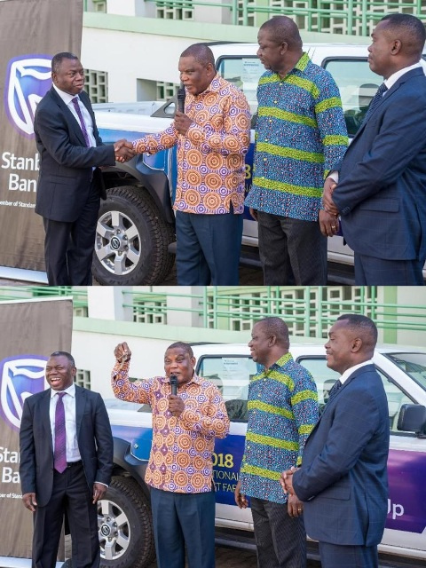 Mr Mawuko Afadzinu, Head of Marketing and Communications presenting the pick-up truck