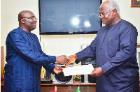 Vice president Dr Bawumia making a presentation to Sierra Leone's President, Ernest Bai Koroma