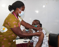 A photo of a nurse administering the coronavirus vaccine