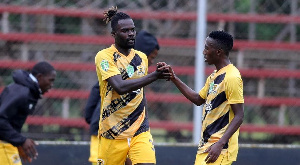 Anas Mohammed celebrates with a team mate