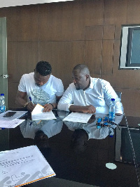 Atinga signing his contract