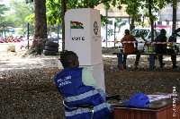 An officer sits  idle as voters did not turn up to cast their vote