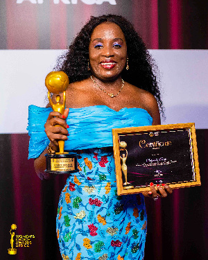 Antoinette Kwofie, Chief Finance Officer in a pose with her award