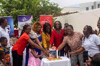 HR Director of Vodafone cutting cake with domestic violence surviving