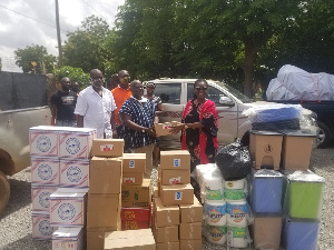 Ursula Owusu-Ekuful presenting the items to Osabarima Ofosuhene Apenteng II, Asuomhene