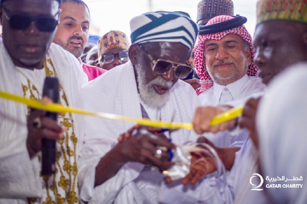 The Chief Imam being supported by the Qatari team to commission the project