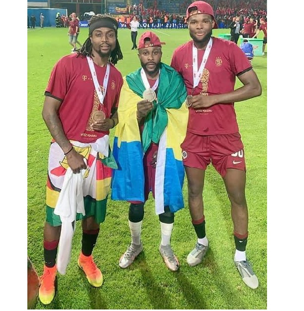 Benjamin Tetteh (on the right) with his mates displaying their medal