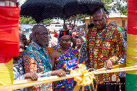 Hon. Dr. Nana Ayew Afriye with elders of the community