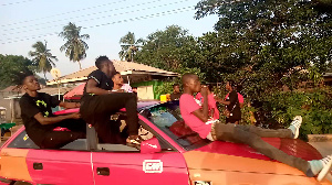 'Mourners' atop a speeding vehicle