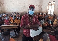 Desmond Kampoe pictured with his students