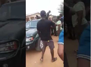 The angry Nigerians blocked the road and prevented the officers from leaving the scene