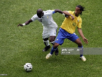 Stephen Appiah and Ronaldinho of Brazil