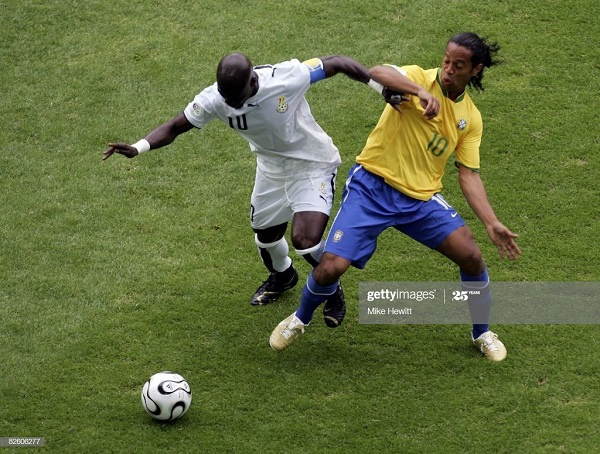 Stephen Appiah and Ronaldinho of Brazil