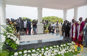 Akufo-Addo with clergymen at the newly designed tomb of Atta-Mills