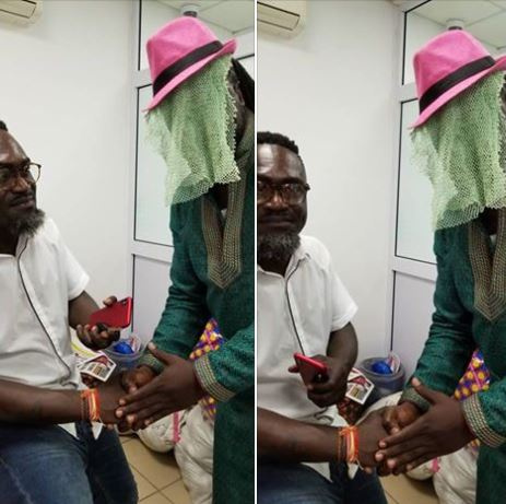 Countryman Songo receiving a handshake from 'Anas'