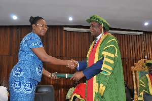 MD of Zoomlion, Mrs. Florence Larbi receiving the plaque from Mr. Kwame Saarah-Mensah