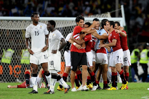 The Black Stars in disappointment as the Egyptians jubilate