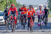 Yolanda Cuba with some of her staff cycling in some key streets Accra