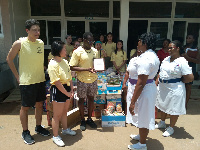 Members of Hugs for Ghana donating to the Child Health Department of KBTH