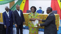 Mrs. Sappor, receiving the award from Paul Kofi Fynn including Charles Ofori Acquah and Mr. Sappor.