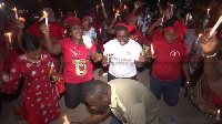 Participants holding candles during the vigil