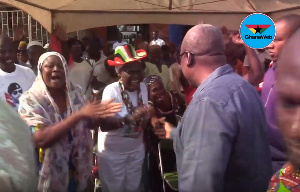 Former President John Mahama interacting with some jubilant women at Winneba