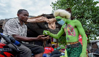 A performing artist has been handing out hand sanitiser in Dar es Salaam