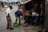 Johannesburg Metro Police Department (JMPD) officers confiscate goods from an informal trading pos