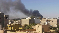 Smoke rises amid clashes between armed factions in Tripoli, Libya on August 15, 2023.