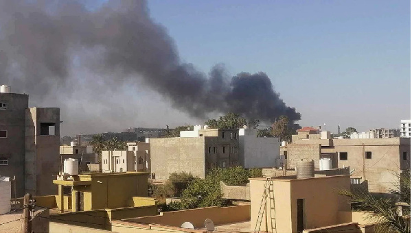 Smoke rises amid clashes between armed factions in Tripoli, Libya on August 15, 2023.