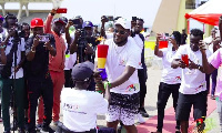 Asamoah Gyan receiving the torch