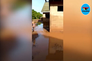 A building in the area partially submerged in flood water