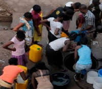 Some residents in a queue to fetch water