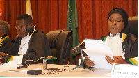 African Court Judge Hon Justice Imani Aboud (R) reading a judgment