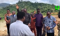 Clergymen praying at a galamsey site